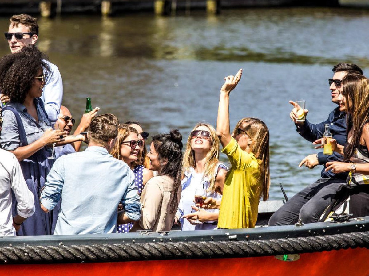 a group of people in a boat on a body of water