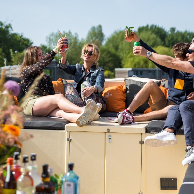 a group of people sitting on a bench