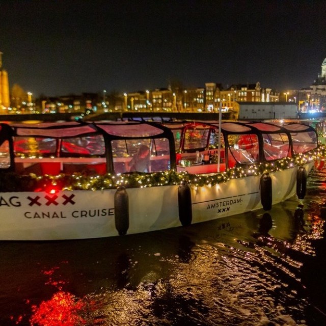 a boat that is lit up at night